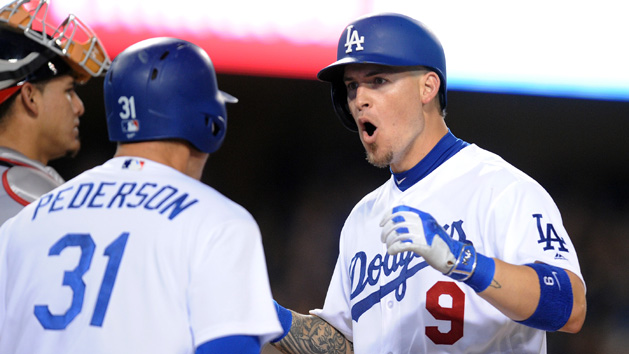 June 21, 2016; Los Angeles, CA, USA; Los Angeles Dodgers catcher Yasmani Grandal (9) celebrates with center fielder Joc Pederson (31) his three run home run in the eighth inning against the Washington Nationals at Dodger Stadium. Photo Credit: Gary A. Vasquez-USA TODAY Sports