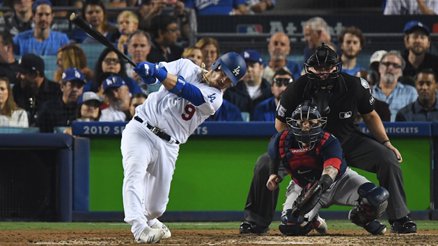 Oct 26, 2018; Los Angeles, CA, USA; Los Angeles Dodgers catcher Yasmani Grandal (9) hits a single in the fifth inning against the Boston Red Sox in game three of the 2018 World Series at Dodger Stadium. Photo Credit: Jayne Kamin-Oncea-USA TODAY Sports