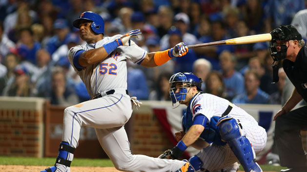 October 20, 2015; Chicago, IL, USA; New York Mets center fielder Yoenis Cespedes (52) hits an RBI single in the seventh inning against the Chicago Cubs in game three of the NLCS at Wrigley Field. Mandatory Credit: Jerry Lai-USA TODAY Sports