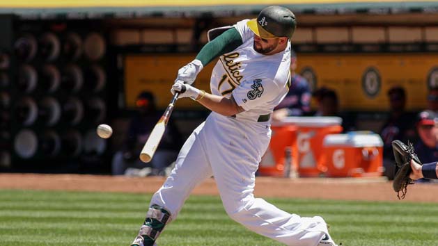 Jul 30, 2017; Oakland, CA, USA; Oakland Athletics first baseman Yonder Alonso (17) hits an RBI double against the Minnesota Twins during the six inning at Oakland Coliseum. Photo Credit: Sergio Estrada-USA TODAY Sports